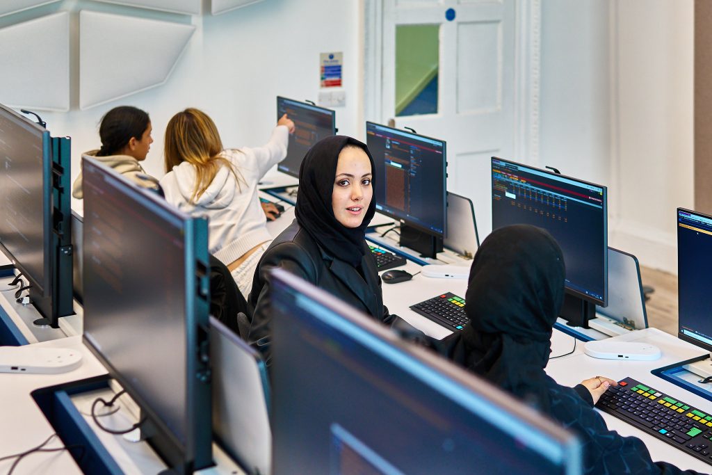 Students at Guildhouse learning how to use Bloomberg Terminals